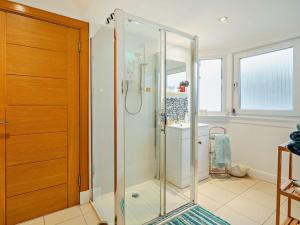 a glass shower in a bathroom with a sink at 1 Bed in Burntisland oc-47388 in Kinghorn +11 photos