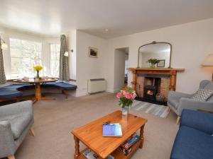a living room with a couch and a table at 2 Bed in Applecross oc-ca422 in Applecross