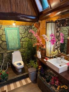 a bathroom with a toilet and a sink at P P Garden Home Bungalow in Phi Phi Islands +126 photos