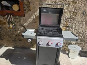 a grill with a laptop on top of it at Apartma Devs in Kranjska Gora