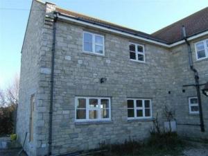 a large brick building with windows on the side of it at Swallows Rest in Weymouth
