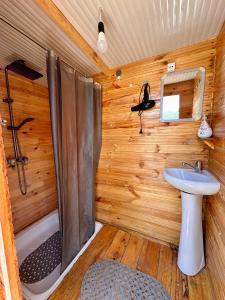 a bathroom with a shower and a sink at Kilemche Boutique Hotel & Yurt Camp in Bagysh +20 photos