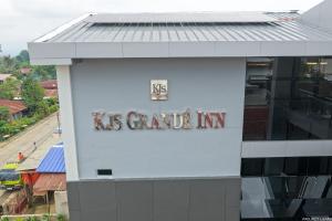 a building with the usgate inn sign on it at KJSGrandeInn in Manolo Fortich
