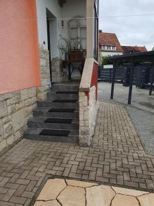 a building with a staircase in front of a house at Achims Hüttl in Bad Berka +1 photo