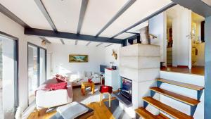 a living room with white walls and blue ceilings at Tschuggen TU14 in Blatten bei Naters