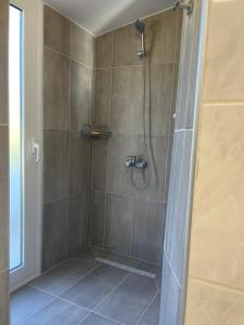 a shower with a glass door in a bathroom at Villa Fay in Preveza +28 photos