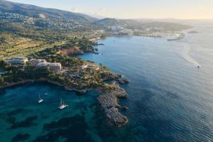 an aerial view of a bay with boats in the water at Mandarin Oriental Punta Negra, Mallorca in Palmanova