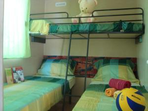 Postel nebo postele na pokoji v ubytování Mobile Homes Vila Punta