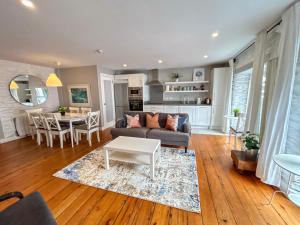a living room with a couch and a table at Apartments in Dingle Town Center in Dingle