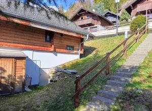 a set of stairs leading up to a building at Tschuggen TU14 in Blatten bei Naters