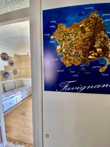 a map of australia on a wall in a room at Al centro con panorama Favignana Isole Egadi in Favignana +25 photos