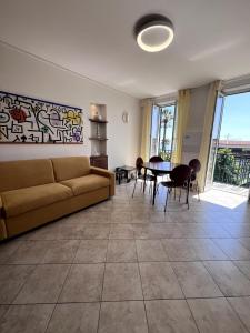 a living room with a couch and a table at Appartamento 37 Varazze in Varazze
