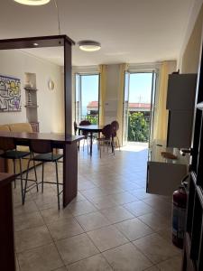 a kitchen and dining room with a table and chairs at Appartamento 37 Varazze in Varazze
