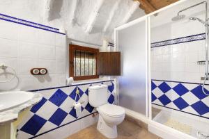 a bathroom with a toilet and a sink at La Barraca den Salvador in Deltebre +15 photos