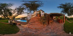 a set of stairs leading up to a house at Villa Freebird - VIP Wedding & Bachelor Events in Pefkochori