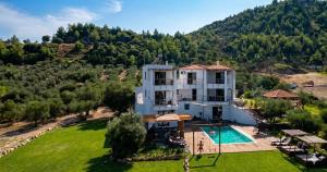 an aerial view of a house with a swimming pool at Villa Freebird - VIP Wedding & Bachelor Events in Pefkochori