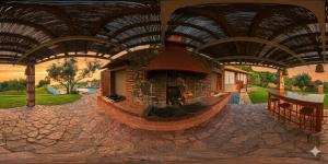 a painting of a house with a fireplace in the middle at Villa Freebird - VIP Wedding & Bachelor Events in Pefkochori +45 photos