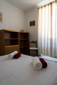 a bedroom with a bed with towels on it at Casa Vacanze VENDITTO in Pietraroia