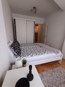 a bedroom with a large bed in a room at Venus Deluxe Apartment in Strumica