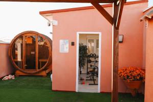 a house with a large door and a large barrel at Villa Preciosa de Luxe and Spa in Mazarrón