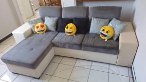 four sponge bob cushions sitting on a couch at Maison, jardin, barbecue et vélo classé 3 étoiles in Dives-sur-Mer