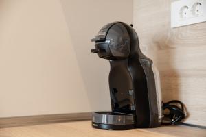 a black hair dryer sitting on top of a counter at Adriatic Sea Escape B20 in Herceg-Novi