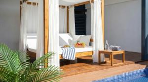 a porch with a table and a mirror at Villa Kala in Sant Pere de Ribes