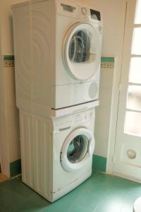 a washing machine and a dryer in a room at Historic Villa with a Private Pool in Mosta