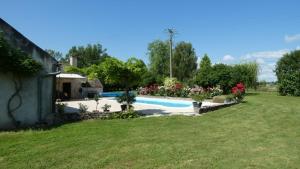 a large yard with a swimming pool in a yard at L'Auberge de Reullée in Marigny-lès-Reullée +21 photos