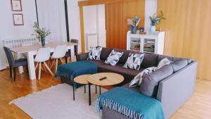 a living room with a couch and a table at El Rincón del Ángel in Jaca