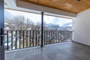 a balcony with a view of the mountains at Mestia HOTEL AMIRANI in Mestia