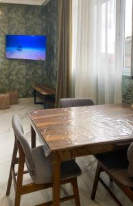 a dining room with a wooden table and chairs at S-Van Cozy Home in Sevan +80 photos