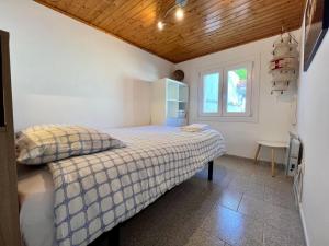 a bedroom with a bed and a window at Casa La Finca in Vigo