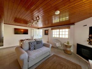 a living room with a couch and a fireplace at Casa La Finca in Vigo