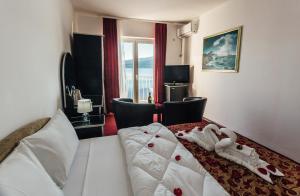 Postel nebo postele na pokoji v ubytování Hotel Azzurro