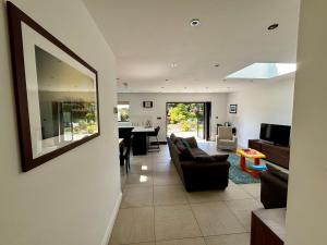 a living room with a couch and a table at Hodder Cottage in The Ribble Valley in Whalley