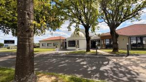 a building with a observatory on the side of a street at The Originals City, Le Patio Hôtel, Cholet Nord in Beaupréau +52 photos