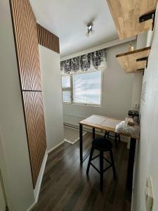 a small room with a table and a window at Pohjankaira in Rovaniemi