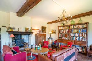 a living room filled with furniture and a fireplace at Maison de charme a Bayonne in Bayonne