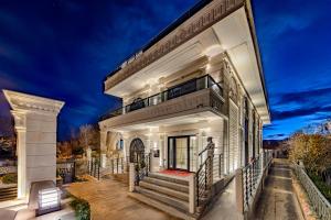 a white house with a staircase leading up to it at WM Cappadocia in Nevşehir