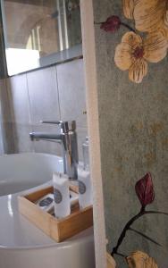 a bathroom with a tray of toilet paper on the tub at Sky Loft La Melissa - Pisa Center in Pisa