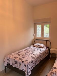a bedroom with a bed and a window at Vila Oaza in Trebinje +19 photos