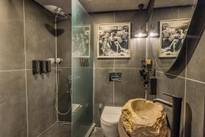 a bathroom with a sink and a toilet and a shower at WM Cappadocia in Nevşehir +16 photos