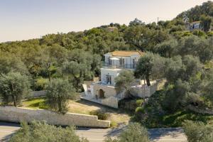 an aerial view of a house with trees at Fereniki's place in Gaios