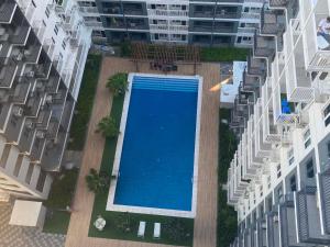 an overhead view of a swimming pool in the middle of a building at UrbanGem Iloilo in Iloilo City