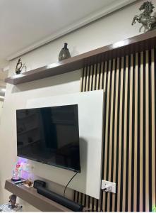 a flat screen tv hanging on a wall at UrbanGem Iloilo in Iloilo City