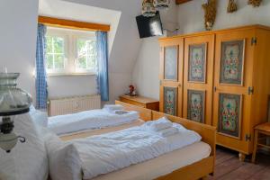 a bedroom with two beds and a window at Pension Arietta in Plauen