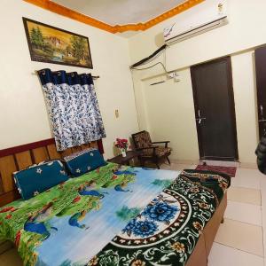 a bedroom with a bed in a room at Hotel B B Pride in Raipur
