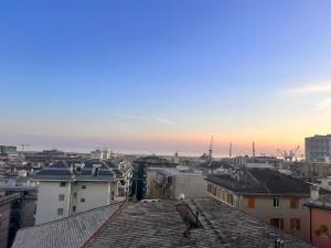 a bird sitting on the roof of a building at Panoramic Terrace & Sea View Flat with Free Parking in Genoa