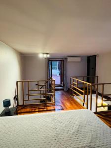 an empty room with a bed and a balcony at APARTAMENT MAYA - Julia Vieste in Vieste